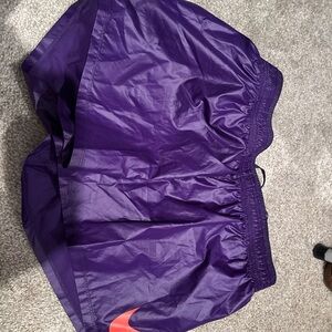 Nike Women's Purple Athletic Shorts with Red Swoosh
